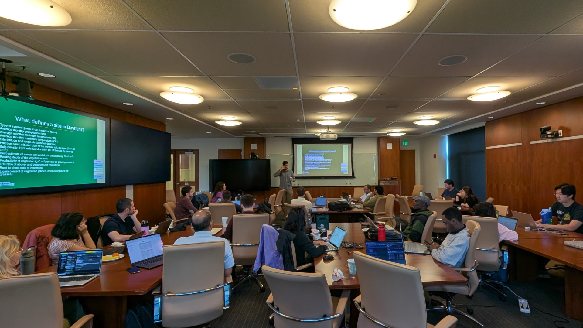 Participants working on laptops during a DayCent training session